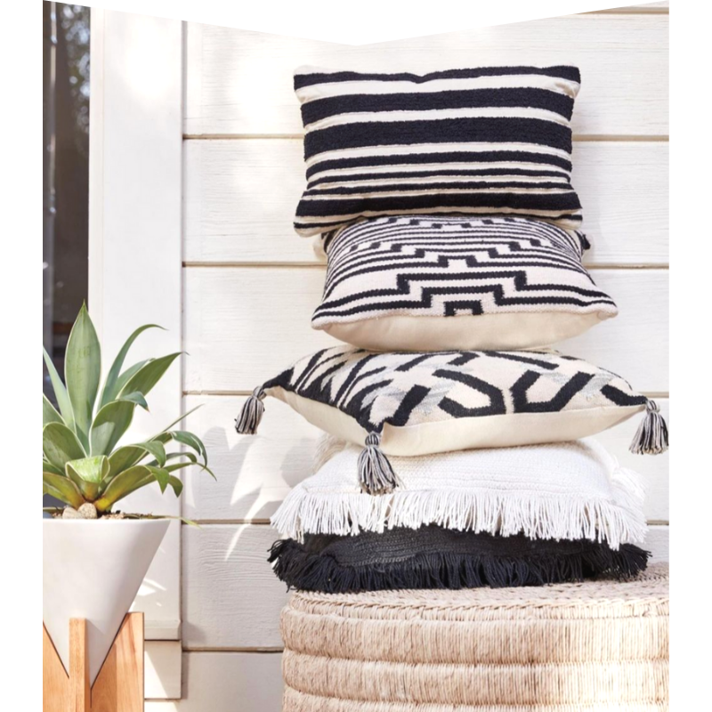 Five black and white pillows.