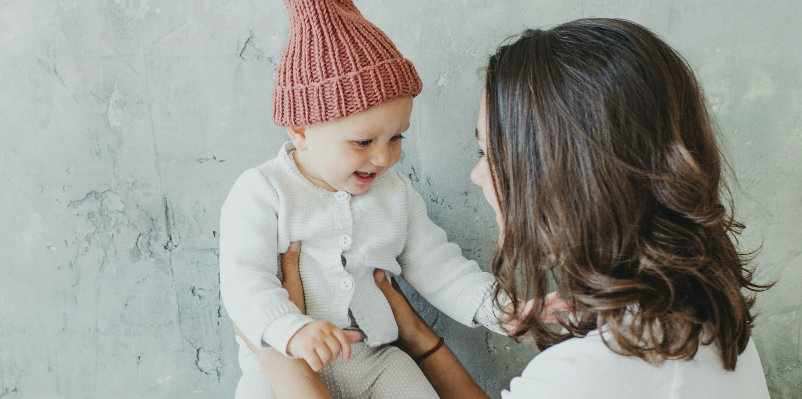 Mom and baby in hat.