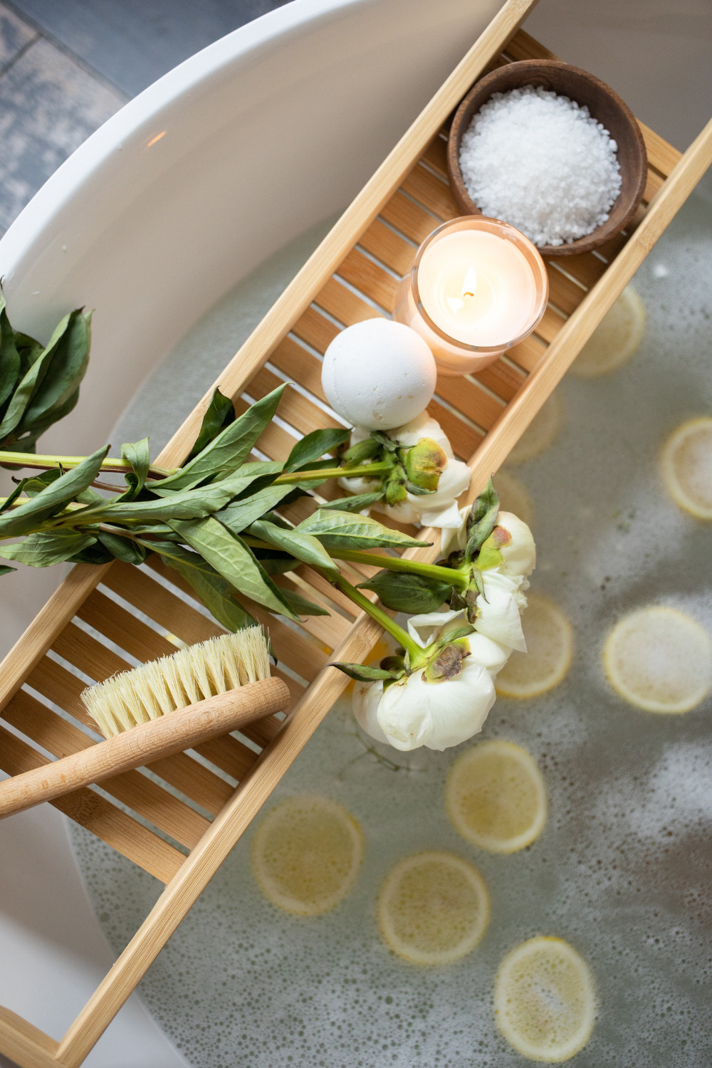 Bathtub with lemons and candles