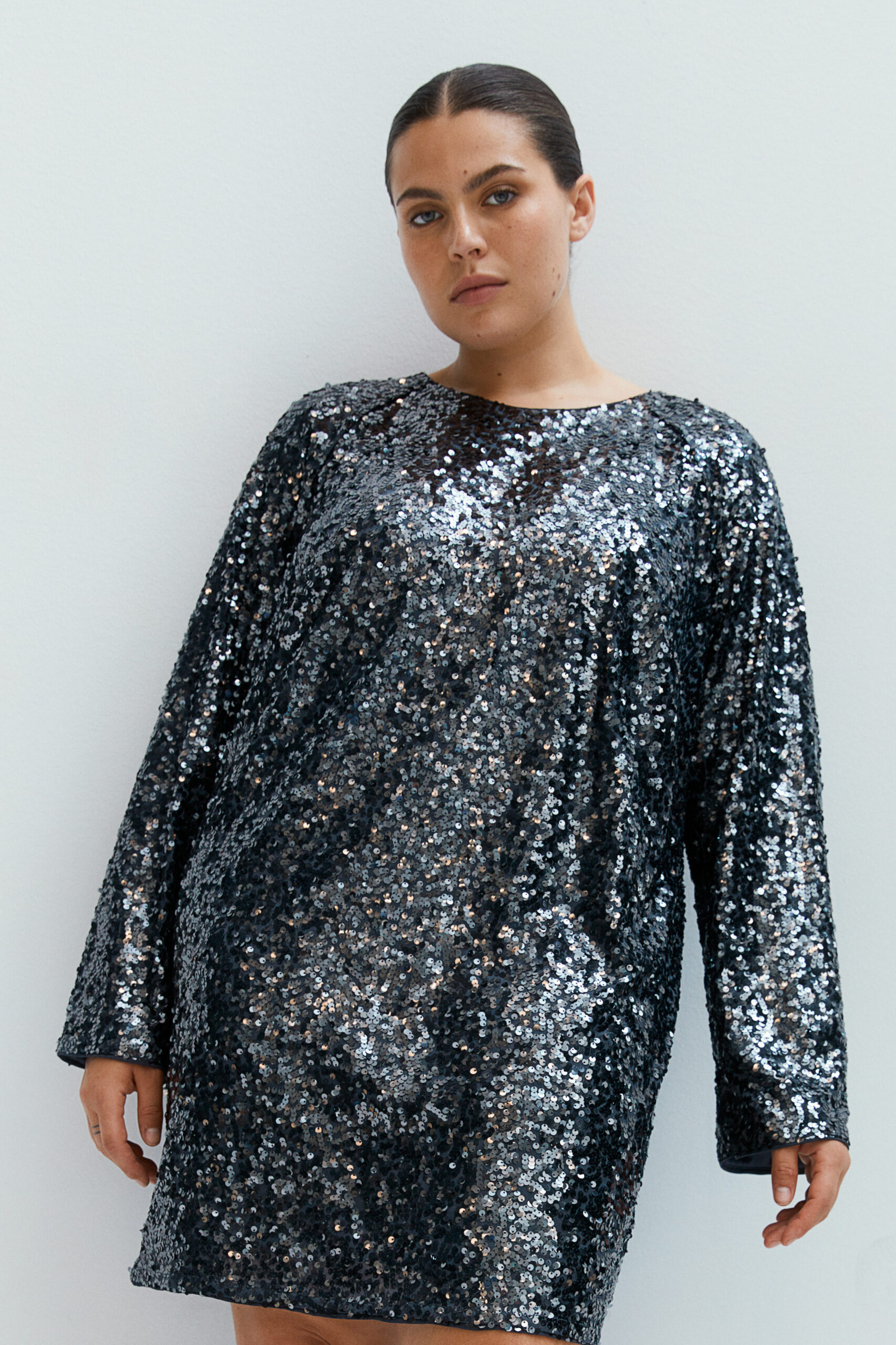Woman wearing a dark sequin dress