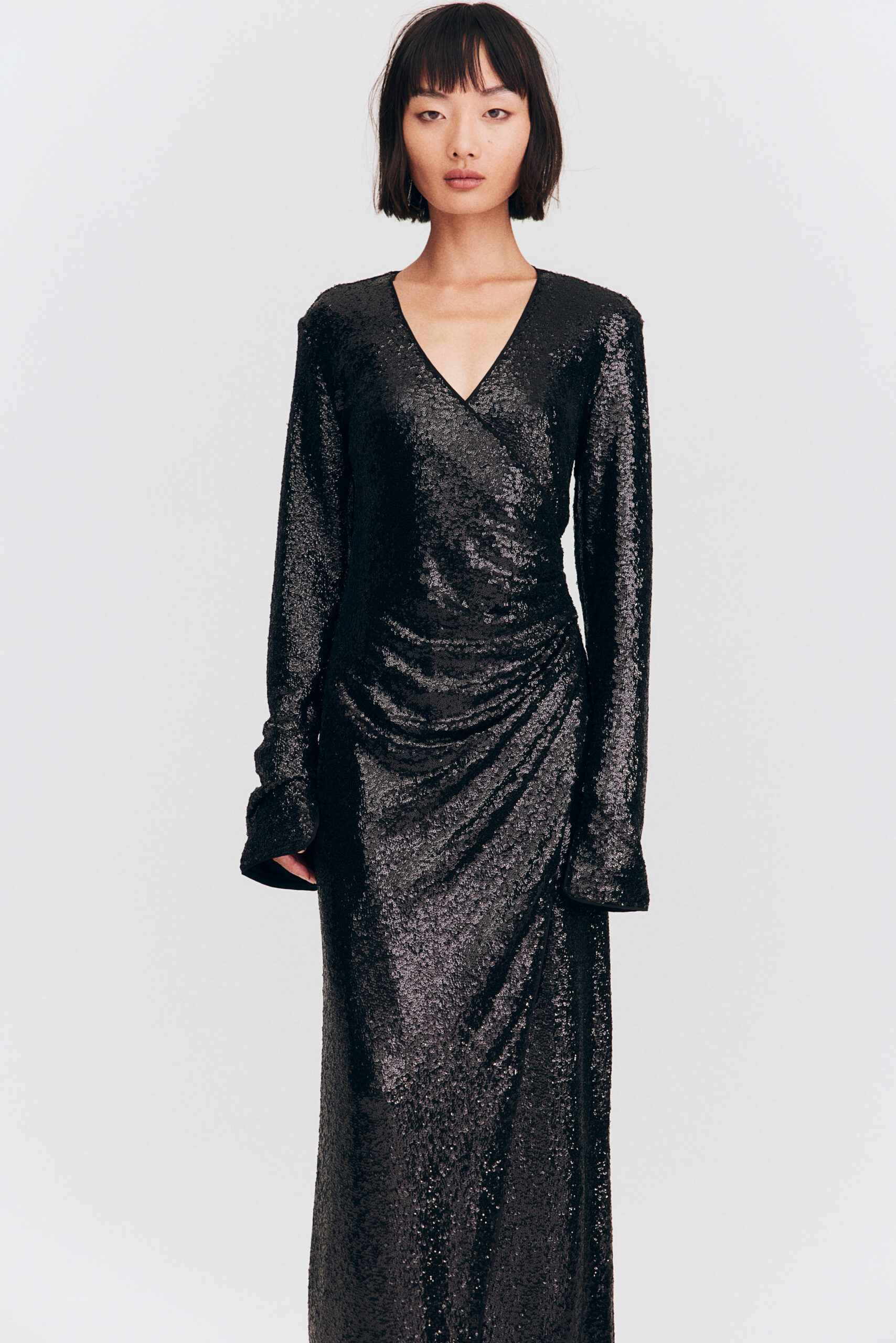Woman wearing a black glittery dress