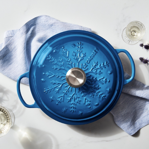 a blue pot with a snowflake design on the lid
