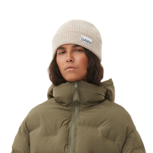 A person wearing a beanie and winter jacket