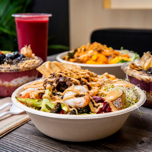 Some bowls of food ona table