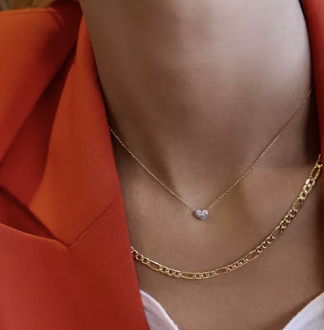 A woman wearing two necklaces