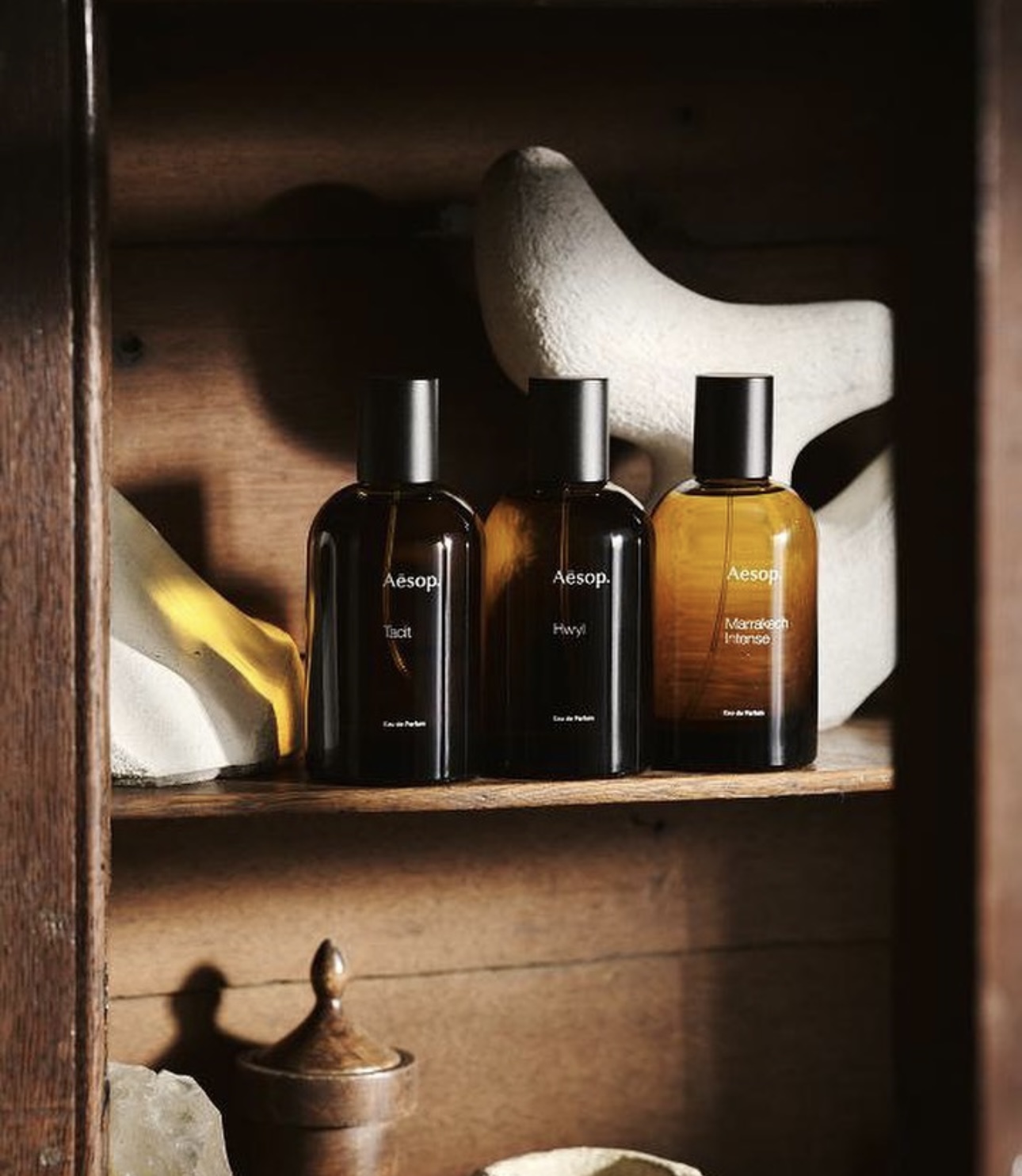 Three small bottles on a shelf