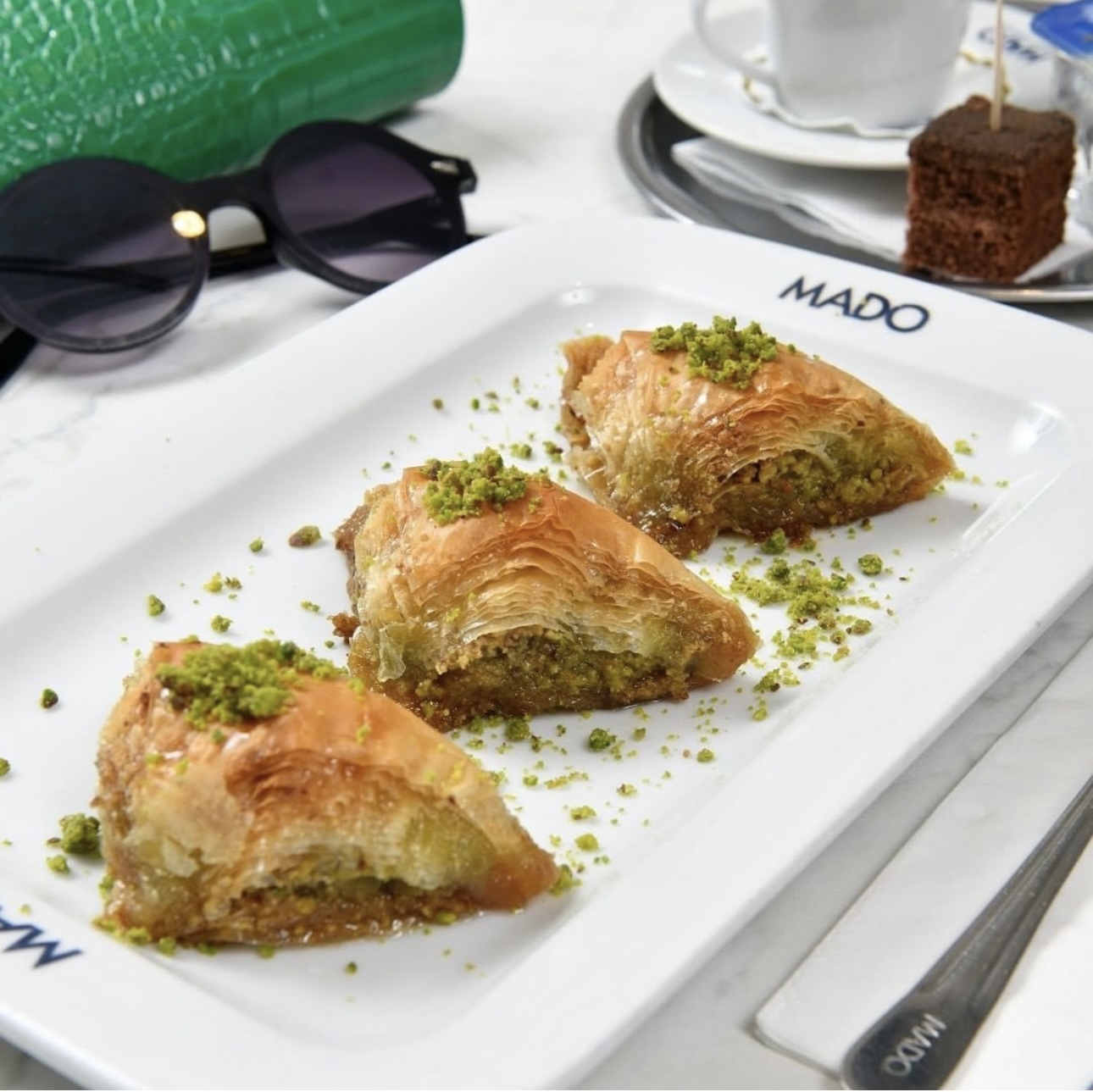 Three small pastries on a rectangular plate